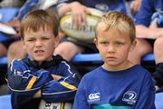 13 August 2010; Daniel Campbell, right, age seven, from Kilgobbin, Co. Dublin, and Hugo Massey, age 7, from Rathgar, Dublin, listen to Brian O'Driscoll and Shane Jennings answer questions at the Centra Leinster Rugby Summer Camps 2010. Donnybrook, Dublin. Picture credit: Ray McManus / SPORTSFILE