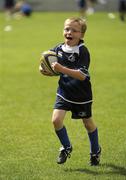 13 August 2010; Six-year-old Adam Whelan, from Rathfarnham, Dublin, during the Centra Leinster Rugby Summer Camps 2010. Donnybrook, Dublin. Picture credit: Ray McManus / SPORTSFILE