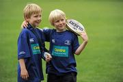 13 August 2010; Eight-year-old Cathal, left, and Dara Joyce, age 6, who are holidaying in Dublin, from Claremorris, Co. Mayo, pose for their mothers camera after attending the Centra Leinster Rugby Summer Camps 2010. Donnybrook, Dublin. Picture credit: Ray McManus / SPORTSFILE