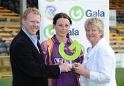 14 August 2010; Wexford's Mary Leacy receives her player of the match award from Joan O'Flynn, President, Cumann Camogaiochta na nGael and Gary Desmond, Chief Executive of Gala. Gala All-Ireland Senior Camogie Championship Semi-Final, Kilkenny v Wexford, Nowlan Park, Kilkenny. Picture credit: Matt Browne / SPORTSFILE