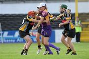 14 August 2010; Wexford's goal-keeper Mags D'Arcy is tackled by Kelly Hamilton, left, and Collette Dormer, Kilkenny. Gala All-Ireland Senior Camogie Championship Semi-Final, Kilkenny v Wexford, Nowlan Park, Kilkenny. Picture credit: Matt Browne / SPORTSFILE