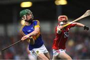 30 June 2016; Paddy Cedell of Tipperary in action against Danny Gunning of Cork during the Electric Ireland Munster GAA Hurling Minor Championship Semi-Final game between Cork and Tipperary at Pairc Ui Rinn in Cork. Photo by Eóin Noonan/Sportsfile