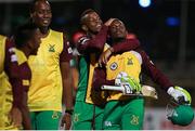 30 June 2016; Shimron Hetmyer of Guyana Amazon Warriors congratulates team-mate Jason Mohammed during Match 2 of the Hero Caribbean Premier League between St Kitts & Nevis Patriots and Guyana Amazon Warriors at Warner Park in Basseterre, St Kitts. Photo by: Ashley Allen/Sportsfile