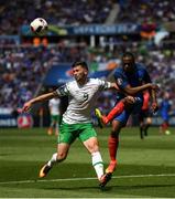 26 June 2016; Patrice Evra of France in action against Shane Long of Republic of Ireland during the UEFA Euro 2016 Round of 16 match between France and Republic of Ireland at Stade des Lumieres in Lyon, France. Photo by Stephen McCarthy/Sportsfile