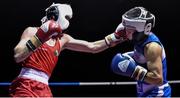 2 July 2016; Chingiz Natyrov of Russia receives a punch from Brendan Irvine of Ireland in their 52kg bout during a Boxing Test Match event between Ireland and Russia at The National Stadium in Dublin. Photo by Sportsfile