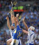 15 August 2010; Eoin Kelly wins possession for Tipperary under pressure from team-mate John O'Brien and Waterford players Richie Foley, right, and Michael Walsh. GAA Hurling All-Ireland Senior Championship Semi-Final, Waterford v Tipperary, Croke Park, Dublin. Picture credit: Ray McManus / SPORTSFILE