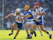 15 August 2010; Stephen Molumphy, Waterford, supported by Seamus Prendergast, right, is tackled by Shane McGrath, Tipperary. GAA Hurling All-Ireland Senior Championship Semi-Final, Waterford v Tipperary, Croke Park, Dublin. Picture credit: Ray McManus / SPORTSFILE
