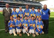 15 August 2010; President of the INTO Jim Higgins, with the Tipperary team, back row, left to right, James McCann, St. Oliver Plunkett’s, Ballyhegan, Co. Armagh, Brendan Gillespie, Creevy N.S., Ballyshannon, Co. Donegal, David Quilter, Lixnaw B.N.S., Co. Kerry, Eoin Savage, St. Mary’s P.S., Portaferry, Co. Down, Conor O’Brien, Watergrasshill N.S., Co. Cork, front row, left to right, Oisín Grant, Gaelscoil Bhun Cranncha, Co. Donegal, Matthew Walsh, Larmenier and Sacred Heart P.S., London, Conal Cunning, St. Joseph’s P.S., Dunloy, Co. Antrim, Peter McCallin, Scoil na Fuiseoige, Co. Antrim, Patrick Garvey, St. Malachy’s P.S., Camlough, Co. Armagh. GAA Into Mini-Sevens during half time of the GAA Hurling All-Ireland Senior Championship Semi-Final, Waterford v Tipperary, Croke Park, Dublin. Picture credit: Ray McManus / SPORTSFILE