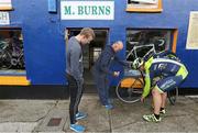 2 July 2016; Mikey Joe Burns from Sneem, Co. Kerry, and his son Aodhán applies oil to the bicycle of Ian Stryker from Abbeyfeale to put him back on his bike during the 2016 Ring of Kerry Charity Cycle. Photo by Valerie O'Sullivan via SPORTSFILE