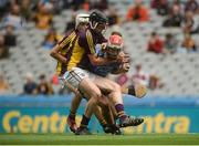 3 July 2016; Paddy Smyth of Dublin in action against Andy Walsh and Rory O'Connor of Wexford, behind, during the Electric Ireland Leinster GAA Hurling Minor Championship Final match between Dublin and Wexford at Croke Park in Dublin. Photo by Piaras Ó Mídheach/Sportsfile