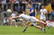 3 July 2016; James McEnroe of Cavan is tackled by Mattie Donnelly of Tyrone during the Ulster GAA Football Senior Championship Semi-Final Replay between Tyrone and Cavan at St Tiemach's Park in Clones, Co Monaghan. Photo by Ramsey Cardy/Sportsfile