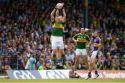 3 July 2016; Kieran Donaghy of Kerry in action against George Hannigan of Tipperary during the Munster GAA Football Senior Championship Final match between Kerry and Tipperary at Fitzgerald Stadium in Killarney, Co Kerry. Photo by Brendan Moran/Sportsfile
