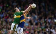 3 July 2016; Mark Griffin of Kerry gets to the ball ahead of Michael Quinlivan of Tipperary during the Munster GAA Football Senior Championship Final match between Kerry and Tipperary at Fitzgerald Stadium in Killarney, Co Kerry. Photo by Brendan Moran/Sportsfile
