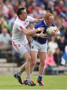 3 July 2016; Cian Mackey of Cavan is tackled by Colm Cavanagh of Tyrone during the Ulster GAA Football Senior Championship Semi-Final Replay between Tyrone and Cavan at St Tiemach's Park in Clones, Co Monaghan. Photo by Ramsey Cardy/Sportsfile