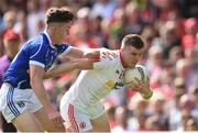 3 July 2016; Connor McAliskey of Tyrone is tackled by Dara McVeety of Cavan during the Ulster GAA Football Senior Championship Semi-Final Replay between Tyrone and Cavan at St Tiemach's Park in Clones, Co Monaghan. Photo by Ramsey Cardy/Sportsfile