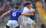 3 July 2016; Mattie Donnelly of Tyrone is tackled by Conor Moynagh, left, and Rory Dunne of Cavan during the Ulster GAA Football Senior Championship Semi-Final Replay between Tyrone and Cavan at St Tiemach's Park in Clones, Co Monaghan. Photo by Ramsey Cardy/Sportsfile