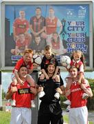 18 August 2010; David McGill, Shelbourne, left, Ken Oman, Bohemians, and Ian Birmingham, St. Patrick's Athletic, right, with from left, Karl Kelly, age 11, from Swords, Jack Burke, age 7, from Stoneybatter, and Jessica Tougher, age 7, from Clondalkin, at the launch of the Dublin City Council European City of Sport billboard campaign to promote Airtricity League football in the city. Malahide Road, Dublin. Picture credit: Brian Lawless / SPORTSFILE
