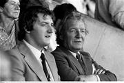 28 August 1983; Fianna Fáil leader Charles Haughey watches the game, with his son Conor, from the stand. All-Ireland Senior Football Championship Semi-Final Replay, Dublin v Cork, Páirc Uí Chaoimh, Cork. Picture credit: Ray McManus / SPORTSFILE