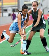 19 August 2010; Jimena Cedres, Argentina, in action against Joanne Orr, Ireland, during their girls preliminary hockey match. Ireland were defeated 3-0. 2010 Youth Olympic Games, Seng Kang Hockey Stadium, Singapore.