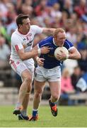 3 July 2016; Cian Mackey of Cavan is tackled by Colm Cavanagh of Tyrone during the Ulster GAA Football Senior Championship Semi-Final Replay between Tyrone and Cavan at St Tiemach's Park in Clones, Co Monaghan. Photo by Ramsey Cardy/Sportsfile