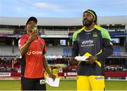 4 July 2016; Dwayne Bravo, left, of Trinbago Knight Riders tosses the coin as Chris Gayle of Jamaica Tallawahs looks on before the start of Match 7 of the Hero Caribbean Premier League between Trinbago Knight Riders and Jamaica Tallawahs at Queen's Park Oval, in Port of Spain, Trinidad. Photo by Randy Brooks/Sportsfile