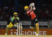 4 July 2016; Brendon McCullum, right, of Trinbago Knight Riders hits a 6 as Kumar Sangakkara of Jamaica Tallawahs looks on during Match 7 of the Hero Caribbean Premier League between Trinbago Knight Riders and Jamaica Tallawahs at Queen's Park Oval, in Port of Spain, Trinidad. Photo by Randy Brooks/Sportsfile