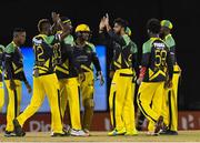 4 July 2016; Imad Wasim of Jamaica Tallawahs celebrates with team-mates after the dismissal of Brendon McCullum Trinbago Knight Riders during Match 7 of the Hero Caribbean Premier League between Trinbago Knight Riders and Jamaica Tallawahs at Queen's Park Oval, in Port of Spain, Trinidad. Photo by Randy Brooks/Sportsfile