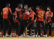 4 July 2016; Kevon Cooper, second from left, of Trinbago Knight Riders celebrates with team-mates after the dismissal of Chadwick Walton of Jamaica Tallawahs during Match 7 of the Hero Caribbean Premier League between Trinbago Knight Riders and Jamaica Tallawahs at Queen's Park Oval, in Port of Spain, Trinidad. Photo by Randy Brooks/Sportsfile