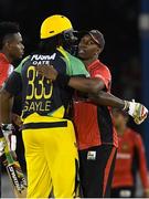 4 July 2016; Chris Gayle, left, of Jamaica Tallawahs and Dwayne Bravo of Trinbago Knight Riders after Match 7 of the Hero Caribbean Premier League between Trinbago Knight Riders and Jamaica Tallawahs at Queen's Park Oval, in Port of Spain, Trinidad. Photo by Randy Brooks/Sportsfile