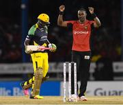 4 July 2016; Dwayne Bravo, right, of Trinbago Knight Riders celebrates the dismissal of Andre Russell of Jamaica Tallawahs during Match 7 of the Hero Caribbean Premier League between Trinbago Knight Riders and Jamaica Tallawahs at Queen's Park Oval, in Port of Spain, Trinidad. Photo by Randy Brooks/Sportsfile