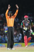 5 July 2016; Umpire Peter Nero signals six runs during Match 8 of the Hero Caribbean Premier League between St Kitts & Nevis Patriots and Barbados Tridents at Warner Park in Basseterre, St Kitts. Photo by Ashley Allen/Sportsfile