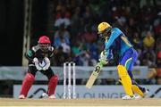 5 July 2016; Shoaib Malik hits the ball into the offside during Match 8 of the Hero Caribbean Premier League between St Kitts & Nevis Patriots and Barbados Tridents at Warner Park in Basseterre, St Kitts. Photo by Ashley Allen/Sportsfile