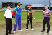 5 July 2016; Patriots captain Faf Du Plessis flicks the coin as Tridents captain Kieron Pollard looks on during Match 8 of the Hero Caribbean Premier League between St Kitts & Nevis Patriots and Barbados Tridents at Warner Park in Basseterre, St Kitts. Photo by Ashley Allen/Sportsfile