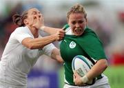 20 August 2010; Niamh Briggs, Ireland, in action against Emily Scarratt, England. 2010 Women's Rugby World Cup - Pool B, England v Ireland, Surrey Sports Park, Guildford, England. Picture credit: Matt Impey / SPORTSFILE