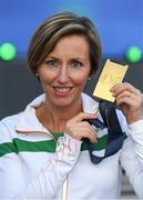 6 July 2016; Olive Loughnane of Ireland with her gold medal for the Women's 20km Walk, from the 2009 IAAF World Championships in Berlin, that she was presented with retrospectively after previous gold medallist Olga Kaniskina of Russia was banned, during a victory ceremony on day one of the 23rd European Athletics Championships at the Olympic Stadium in Amsterdam, Netherlands. Photo by Brendan Moran/Sportsfile