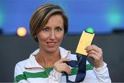 6 July 2016; Olive Loughnane of Ireland with her gold medal for the Women's 20km Walk, from the 2009 IAAF World Championships in Berlin, that she was presented with retrospectively after previous gold medallist Olga Kaniskina of Russia was banned, during a victory ceremony on day one of the 23rd European Athletics Championships at the Olympic Stadium in Amsterdam, Netherlands. Photo by Brendan Moran/Sportsfile