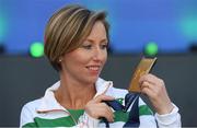 6 July 2016; Olive Loughnane of Ireland with her gold medal for the Women's 20km Walk, from the 2009 IAAF World Championships in Berlin, that she was presented with retrospectively after previous gold medallist Olga Kaniskina of Russia was banned, during a victory ceremony on day one of the 23rd European Athletics Championships at the Olympic Stadium in Amsterdam, Netherlands. Photo by Brendan Moran/Sportsfile