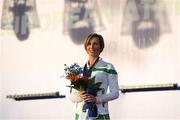6 July 2016; Olive Loughnane of Ireland stands for the Irish national anthem with her gold medal for the Women's 20km Walk, from the 2009 IAAF World Championships in Berlin, that she was presented with retrospectively after previous gold medallist Olga Kaniskina of Russia was banned, during a victory ceremony on day one of the 23rd European Athletics Championships at the Olympic Stadium in Amsterdam, Netherlands. Photo by Brendan Moran/Sportsfile
