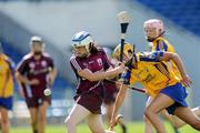 22 August 2010; Ailish O'Reilly, Galway, scores the first goal of the game against Clare, despite the tackle of Joanne Walsh. All-Ireland Minor A Camogie Championship Final, Galway v Clare, Semple Stadium, Thurles, Co. Tipperary. Picture credit: Matt Browne / SPORTSFILE