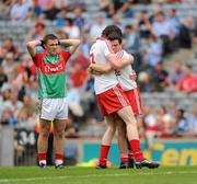 22 August 2010; Mayo's James Shaughnessy looks on as Tyrone players Conor Clarke, left, and Shea McGarrity celebrate. ESB GAA Football All-Ireland Minor Championship Semi-Final, Mayo v Tyrone, Croke Park, Dublin. Picture credit: Ray McManus / SPORTSFILE