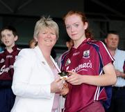 22 August 2010; Laura Mitchell, Galway, receives her player of the match trophy from Joan O'Flynn, President, Cumann Camogaiochta na nGael. All-Ireland Minor A Camogie Championship Final, Galway v Clare, Semple Stadium, Thurles, Co. Tipperary. Picture credit: Matt Browne / SPORTSFILE