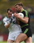 9 July 2016; Aidan O'Shea of Mayo is tackled by Ruairí Corrigan of Fermanagh during the GAA Football All-Ireland Senior Championship Round 2A match between Mayo and Fermanagh at Elvery's MacHale Park in Castlebar, Co. Mayo. Photo by Ramsey Cardy/Sportsfile