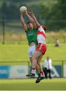 9 July 2016; Harry Rooney of Meath in action against Conor McAtamney of Derry during the GAA Football All-Ireland Senior Championship - Round 2A match between Derry and Meath at Derry GAA Centre of Excellence in Owenbeg, Derry. Photo by Oliver McVeigh/Sportsfile