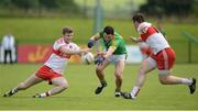 9 July 2016; Padraic Harnan of Meath in action against Niall Holly and Mark Lynch of Derry during the GAA Football All-Ireland Senior Championship - Round 2A match between Derry and Meath at Derry GAA Centre of Excellence in Owenbeg, Derry. Photo by Oliver McVeigh/Sportsfile