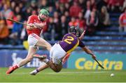 9 July 2016; Daniel Kearney of Cork shoots to score his side's first goal despite the tackle of of Eoin Moore of Wexford during the GAA Hurling All-Ireland Senior Championship Round 2 match between Cork and Wexford at Semple Stadium in Thurles, Tipperary. Photo by Stephen McCarthy/Sportsfile