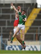 9 July 2016; Brian Fanning of Limerick  in action against Alan O'Connor of Cork during the GAA Football All Ireland Senior Championship Round 2A match between Limerick and Cork at Semple Stadium in Thurles, Tipperary. Photo by Eóin Noonan/Sportsfile