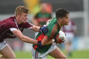 10 July 2016; Colm Moran of Mayo is tackled by Eoin McFadden of Galway during the Electric Ireland Connacht GAA Football Minor Championship Final between Galway and Mayo at Pearse Stadium in Galway. Photo by Ramsey Cardy/Sportsfile