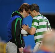 23 August 2010; Stephen Rice, Shamrock Rovers, dries the wet ball using the vest from a ballboy before taking a throw in. Airtricity League Premier Division, Shamrock Rovers v UCD, Tallaght Stadium, Tallaght, Dublin. Picture credit: David Maher / SPORTSFILE