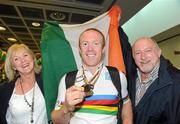 24 August 2010; Mark Rohan, from Athlone, Co. Westmeath, with his mother Carmel and father Denis, on his return home after securing Ireland's first ever Paracycling World Championship Gold Medal by winning the H1 Handcycling Road Race in Baie-Comeau Canada. Dublin Airport, Dublin. Picture credit: Brian Lawless / SPORTSFILE