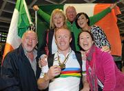 24 August 2010; Mark Rohan, from Athlone, Co. Westmeath, with his family, from left, Denis, father, Carmel, mother, Robert, brother, sisters Laura and Nicola  on his return home after securing Ireland's first ever Paracycling World Championship Gold Medal by winning the H1 Handcycling Road Race in Baie-Comeau Canada. Dublin Airport, Dublin. Picture credit: Brian Lawless / SPORTSFILE